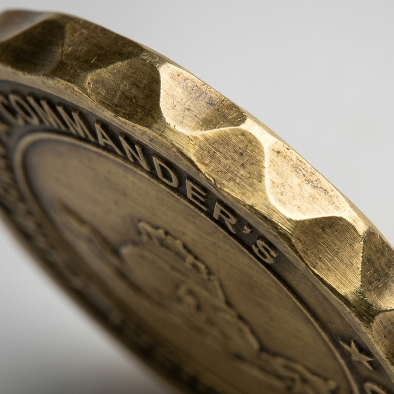 Bezel edge treatment on a challenge coin
